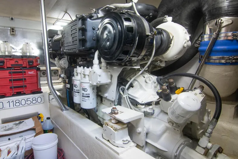 Pipe Dream Yacht Photos Pics Engine room of 2005 Ocean Yachts 50 Super Sport with CAT machinery and storage boxes.