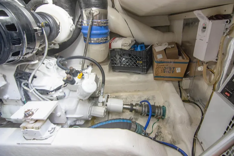 Pipe Dream Yacht Photos Pics Engine room of 2005 Ocean Yachts 50 Super Sport with mechanical components and storage.