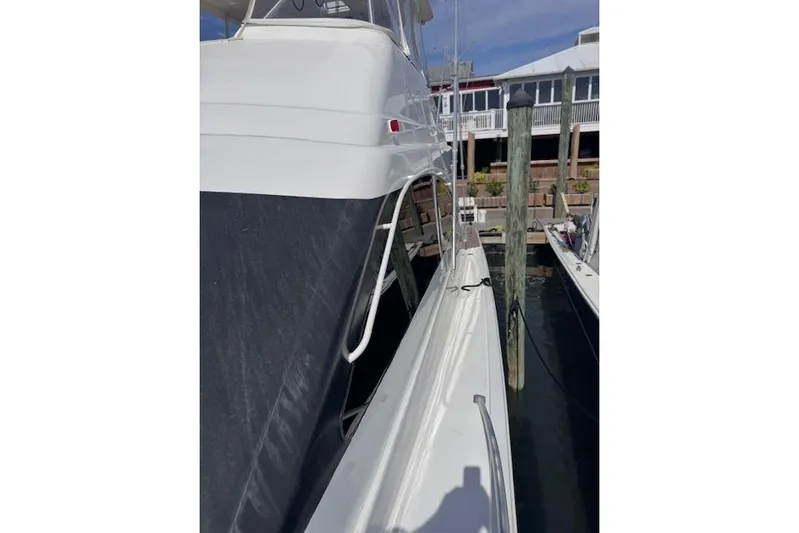 Pipe Dream Yacht Photos Pics 2005 Ocean Yachts 50 Super Sport docked at marina, side view.