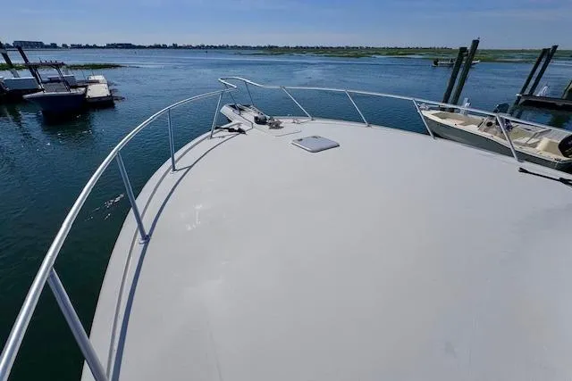 Pipe Dream Yacht Photos Pics Bow view of 2005 Ocean Yachts 50 Super Sport on calm water.