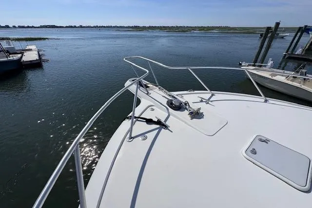 Pipe Dream Yacht Photos Pics 2005 Ocean Yachts 50 Super Sport on calm waters, showcasing sleek bow design.