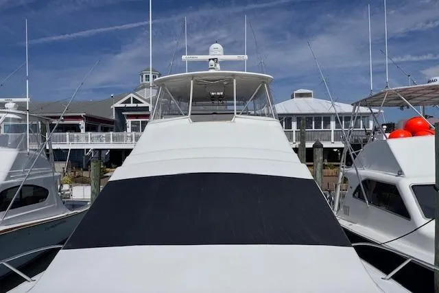 Pipe Dream Yacht Photos Pics 2005 Ocean Yachts 50 Super Sport docked at marina under clear sky.