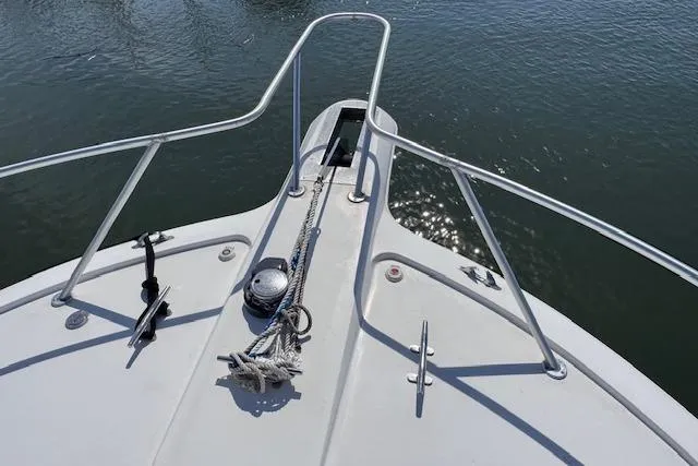 Pipe Dream Yacht Photos Pics Bow view of 2005 Ocean Yachts 50 Super Sport on calm water.