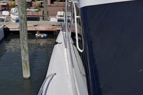 Pipe Dream Yacht Photos Pics 2005 Ocean Yachts 50 Super Sport docked at marina, side view.