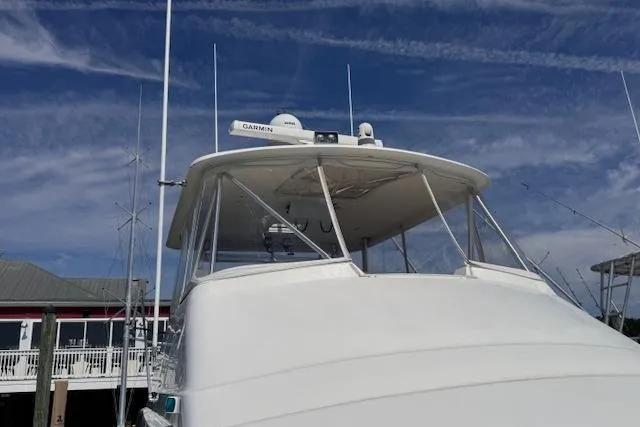Pipe Dream Yacht Photos Pics 2005 Ocean Yachts 50 Super Sport boat docked under a clear blue sky.