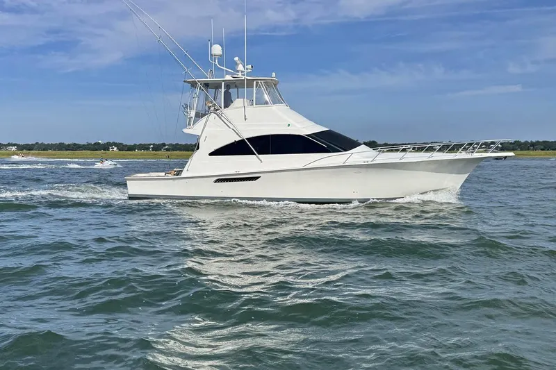 Pipe Dream Yacht Photos Pics 2005 Ocean Yachts 50 Super Sport cruising on open water under clear skies.