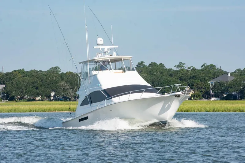 Pipe Dream Yacht Photos Pics 2005 Ocean Yachts 50 Super Sport cruising on a scenic waterway.
