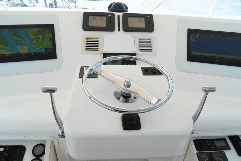 Pipe Dream Yacht Photos Pics Helm of 2005 Ocean Yachts 50 Super Sport with navigation displays and controls.