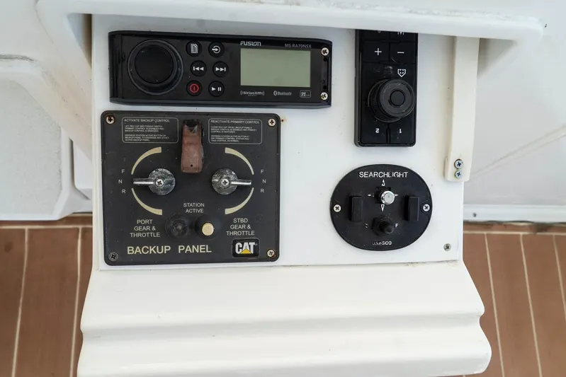 Pipe Dream Yacht Photos Pics Control panel of a 2005 Ocean Yachts 50 Super Sport, featuring backup and searchlight controls.