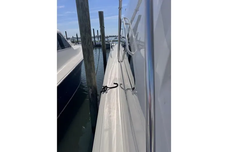 Pipe Dream Yacht Photos Pics 2005 Ocean Yachts 50 Super Sport docked at marina, side view.