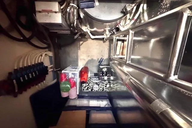 Pipe Dream Yacht Photos Pics Pump room of 2005 Ocean Yachts 50 Super Sport with organized wiring and storage.