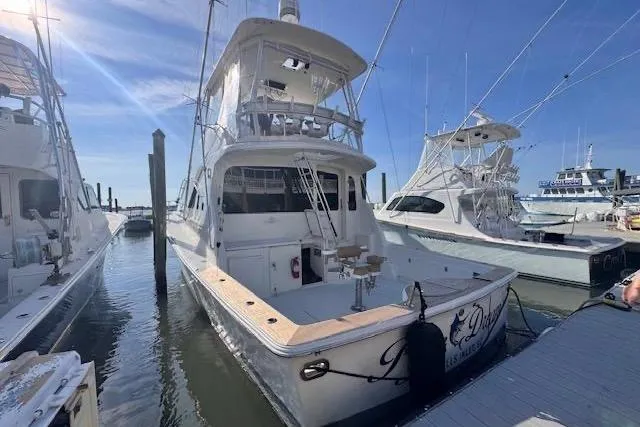 Pipe Dream Yacht Photos Pics 2005 Ocean Yachts 50 Super Sport docked at marina under clear blue sky.