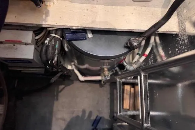 Pipe Dream Yacht Photos Pics Pump room of 2005 Ocean Yachts 50 Super Sport with visible wiring and components.