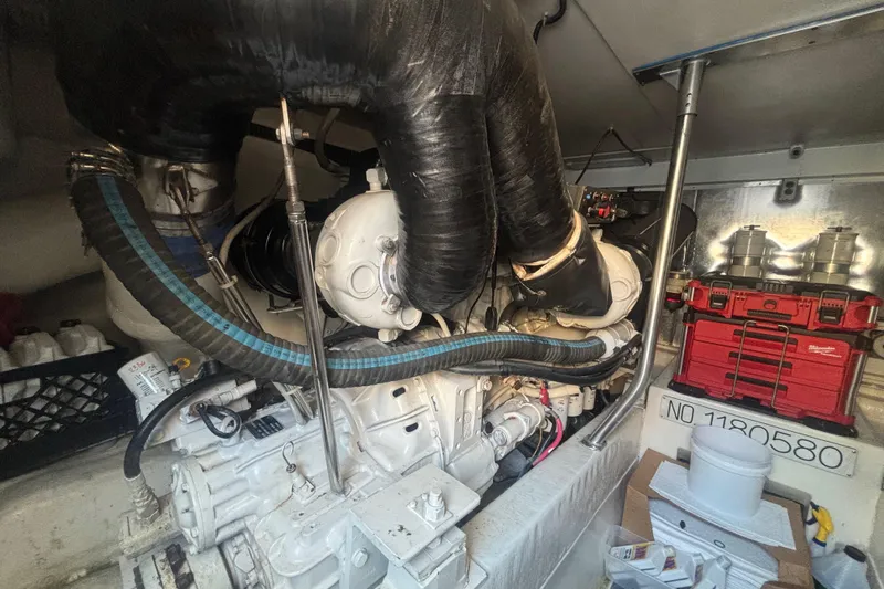 Pipe Dream Yacht Photos Pics Engine room of 2005 Ocean Yachts 50 Super Sport with visible machinery and tools.