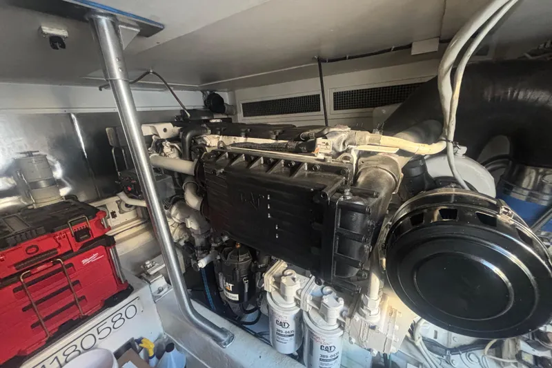 Pipe Dream Yacht Photos Pics Engine room of a 2005 Ocean Yachts 50 Super Sport with visible machinery and tools.