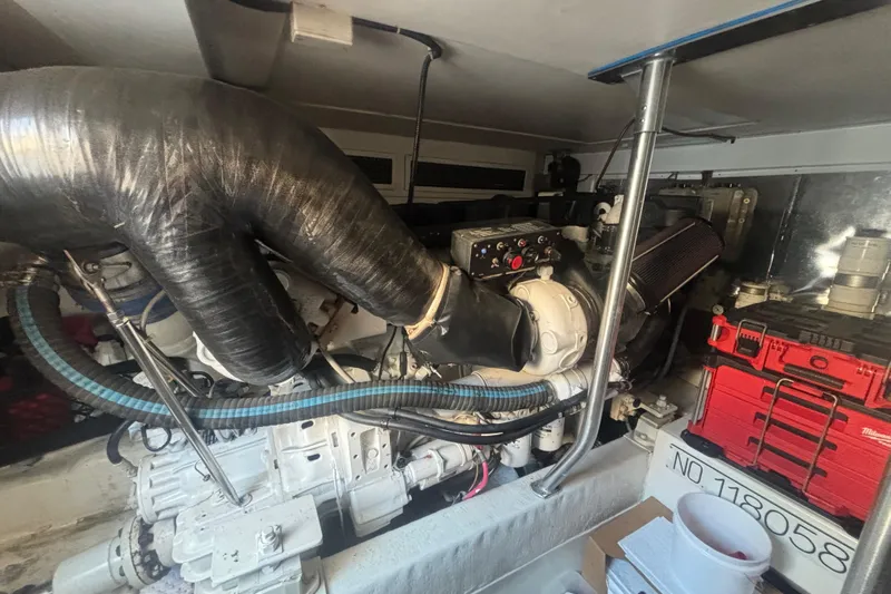 Pipe Dream Yacht Photos Pics Engine room of a 2005 Ocean Yachts 50 Super Sport, showcasing mechanical components and storage.