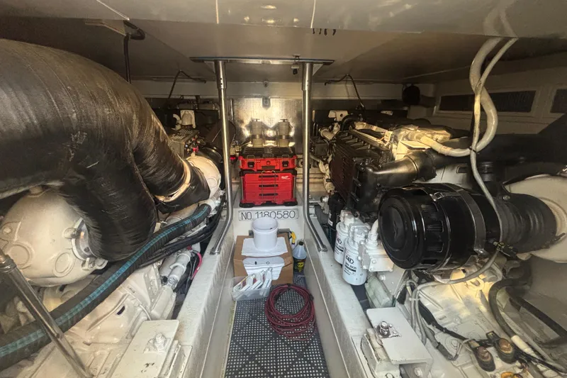 Pipe Dream Yacht Photos Pics Engine room of a 2005 Ocean Yachts 50 Super Sport, showcasing dual engines and equipment.