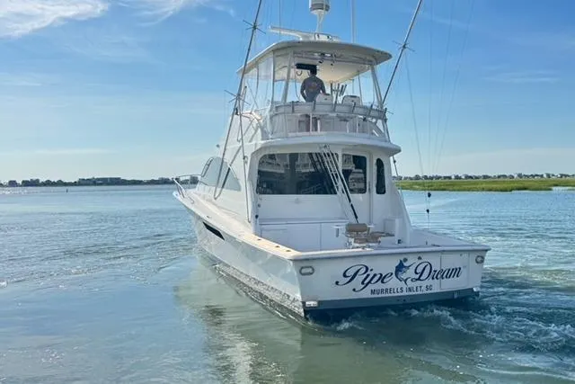 Pipe Dream Yacht Photos Pics 2005 Ocean Yachts 50 Super Sport boat cruising on calm waters.