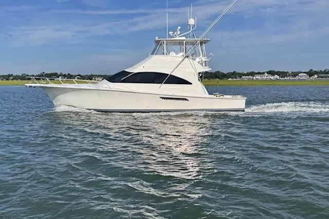 Pipe Dream Yacht Photos Pics 2005 Ocean Yachts 50 Super Sport cruising on calm waters under a clear sky.