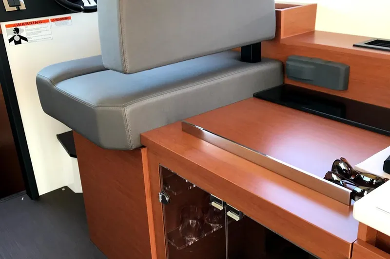  Yacht Photos Pics Interior of 2017 Prestige 420S Coupé with wooden cabinetry and gray seating.