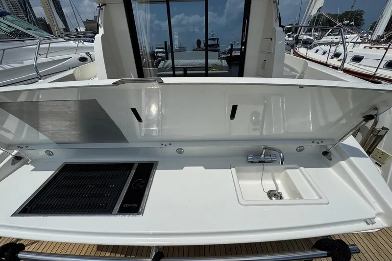  Yacht Photos Pics Outdoor kitchen on a 2017 Prestige 420S Coupé yacht with grill and sink.