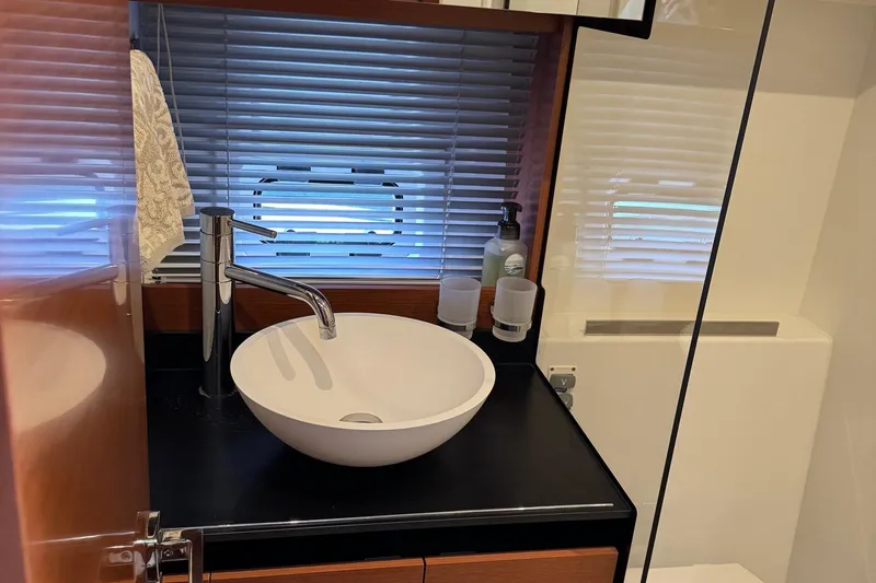  Yacht Photos Pics Modern bathroom sink in 2017 Prestige 420S Coupé yacht, featuring sleek design and accessories.