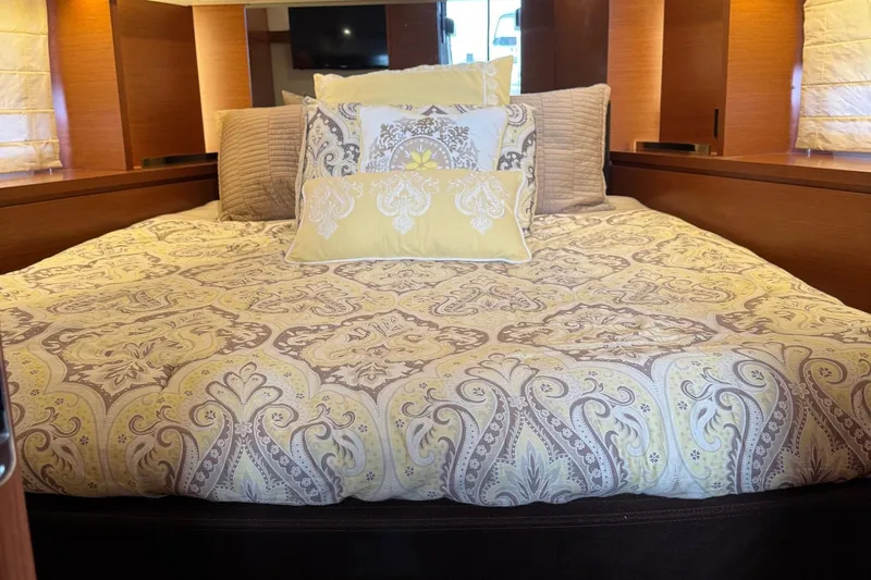  Yacht Photos Pics Luxurious bedroom interior of 2017 Prestige 420S Coupé with elegant patterned bedding.