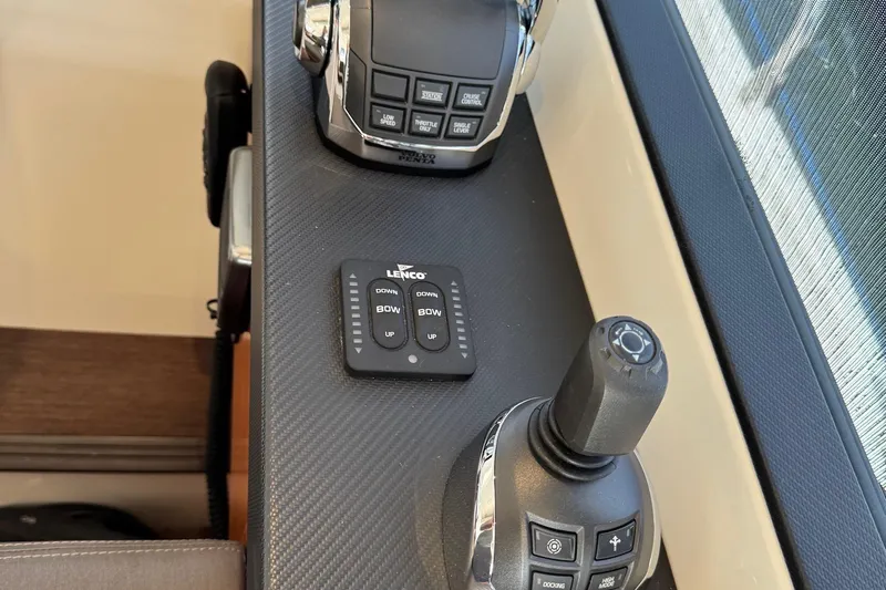  Yacht Photos Pics Control panel of a 2017 Prestige 420S Coupé yacht with joystick and Lenco trim tab.