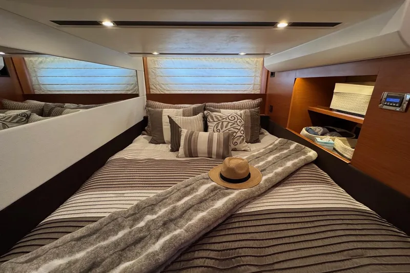  Yacht Photos Pics Luxurious bedroom interior of 2017 Prestige 420S Coupé yacht with elegant decor.