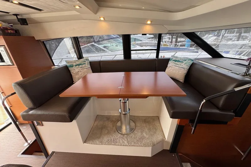  Yacht Photos Pics Interior of 2017 Prestige 420S Coupé yacht with cozy seating and table.