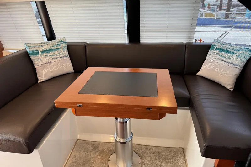  Yacht Photos Pics Luxurious interior of 2017 Prestige 420S Coupé with leather seating and decorative pillows.