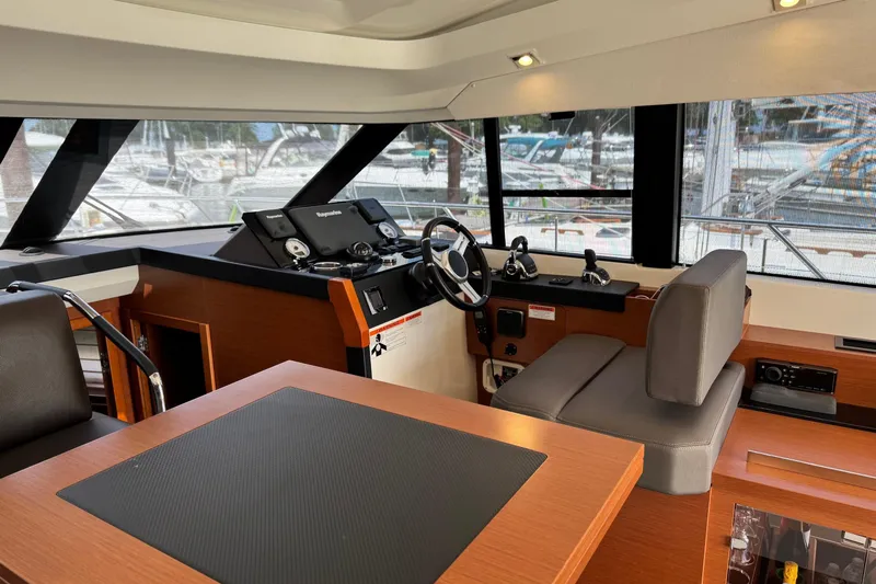  Yacht Photos Pics Interior of 2017 Prestige 420S Coupé yacht, featuring modern helm and seating area.