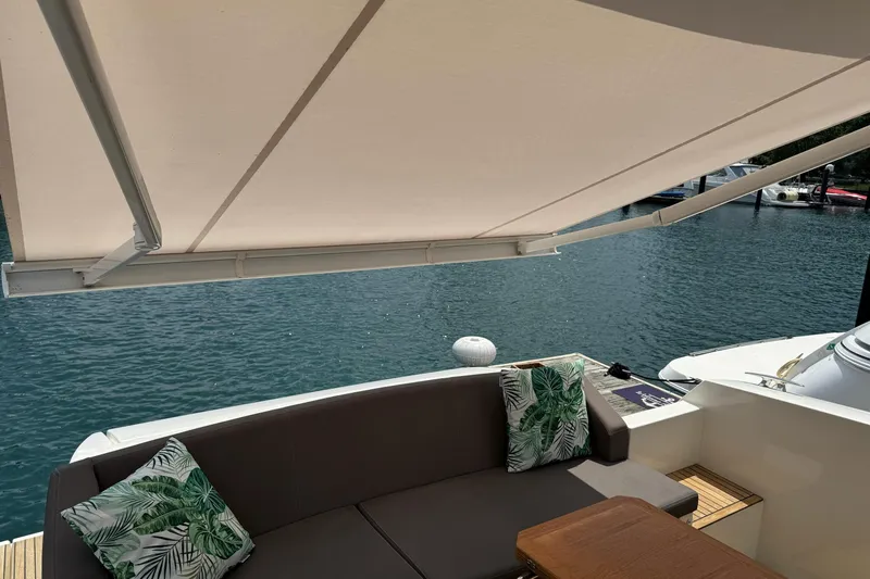  Yacht Photos Pics Luxury yacht Prestige 420S Coupé 2017, featuring shaded seating area with tropical cushions.