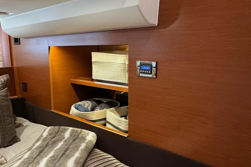  Yacht Photos Pics Interior of 2017 Prestige 420S Coupé with wooden shelving and storage baskets.