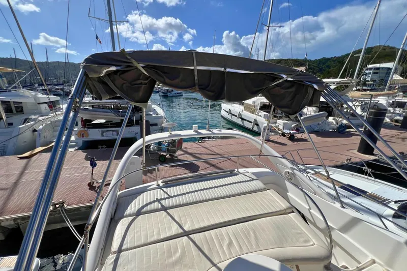  Yacht Photos Pics 2005 Jeanneau Prestige 36 yacht docked at marina under clear blue sky.