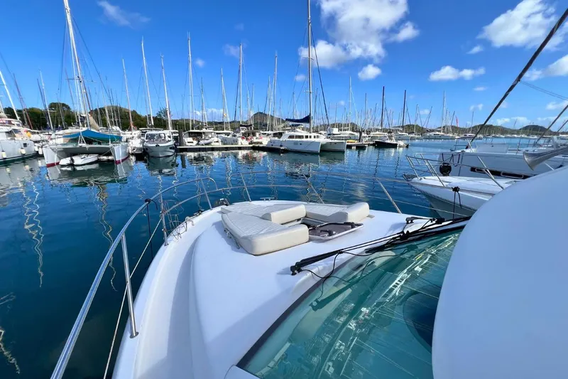  Yacht Photos Pics 2005 Jeanneau Prestige 36 yacht docked in a marina with clear blue skies.