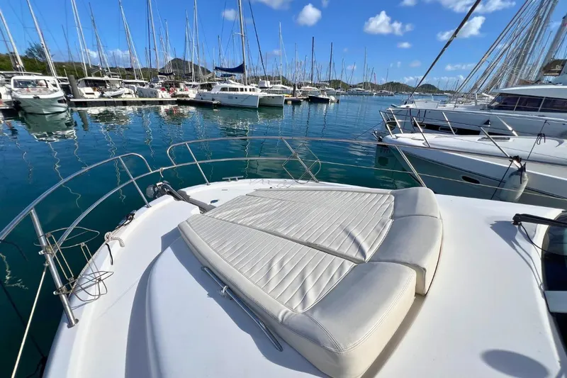  Yacht Photos Pics 2005 Jeanneau Prestige 36 yacht with sunbathing deck in a marina.