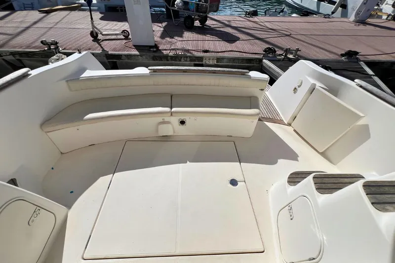  Yacht Photos Pics 2005 Jeanneau Prestige 36 boat deck with seating area, docked at marina.