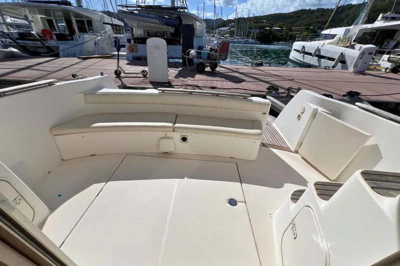  Yacht Photos Pics 2005 Jeanneau Prestige 36 yacht cockpit with seating, docked at marina.