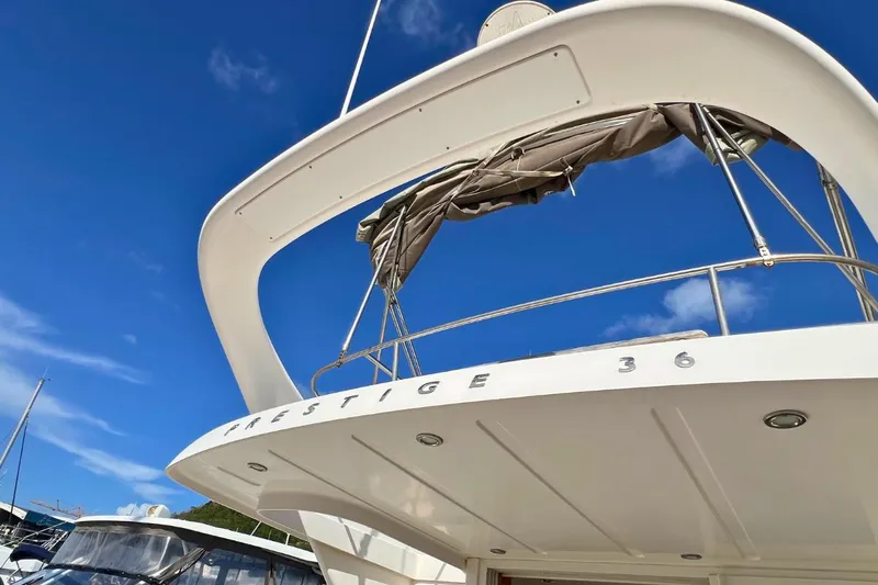  Yacht Photos Pics 2005 Jeanneau Prestige 36 yacht, rear view, under clear blue sky.