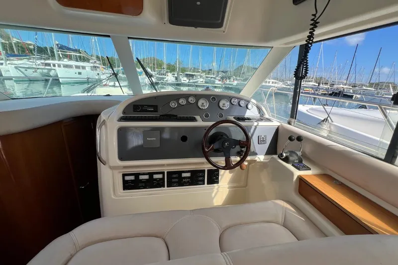  Yacht Photos Pics Helm of 2005 Jeanneau Prestige 36 yacht with marina view.