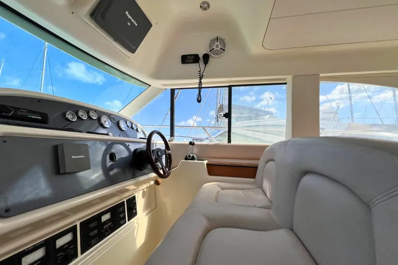  Yacht Photos Pics Interior view of 2005 Jeanneau Prestige 36 yacht cockpit with steering wheel and controls.