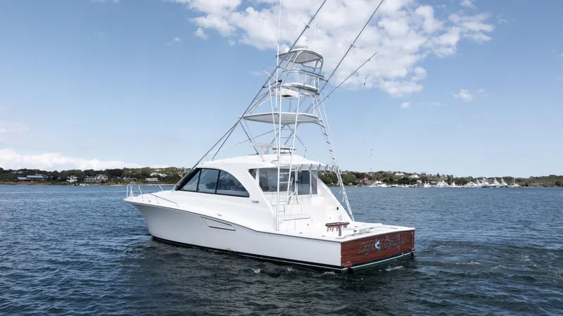 Life Of Reilly 2.0 Yacht Photos Pics 2012 Cabo 44 HTX yacht on calm water under a clear sky.