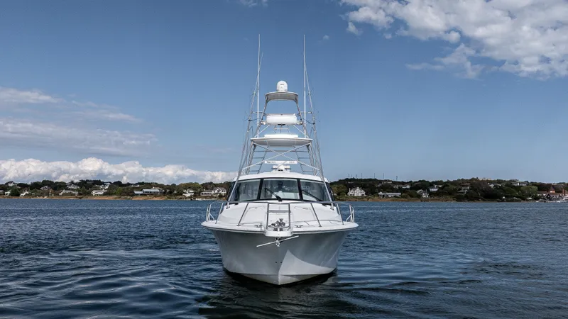 Life Of Reilly 2.0 Yacht Photos Pics 2012 Cabo 44 HTX yacht on calm water under blue sky.