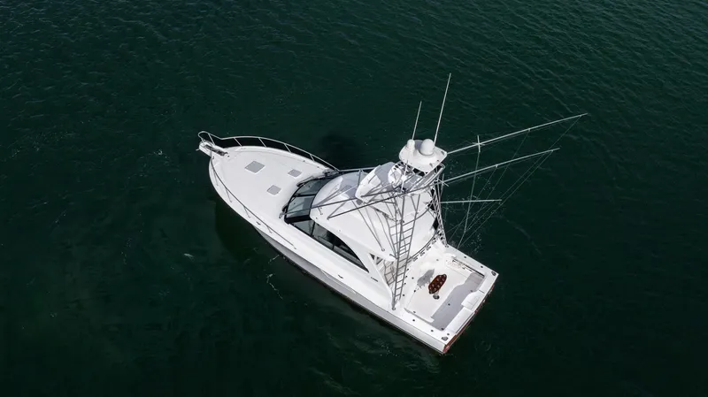 Life Of Reilly 2.0 Yacht Photos Pics Aerial view of 2012 Cabo 44 HTX yacht on calm water.