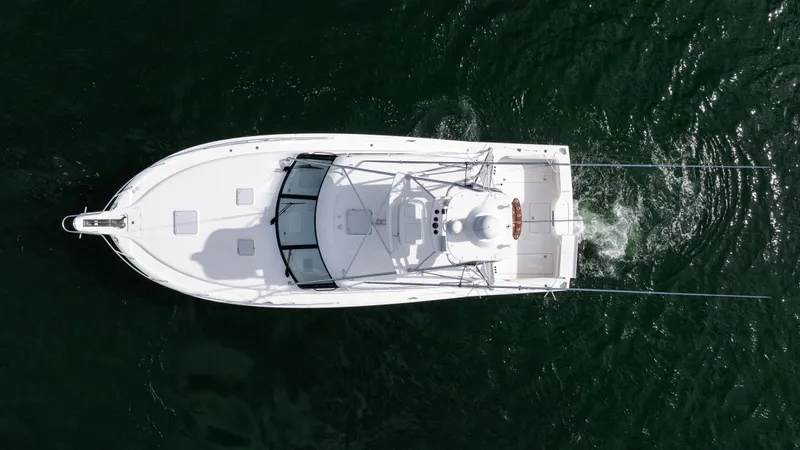 Life Of Reilly 2.0 Yacht Photos Pics Aerial view of 2012 Cabo 44 HTX yacht cruising on water.