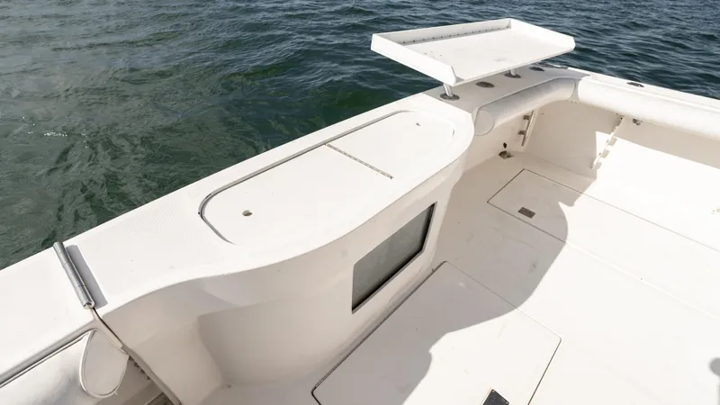 Life Of Reilly 2.0 Yacht Photos Pics 2012 Cabo 44 HTX boat deck with clean, white finish and ocean backdrop.