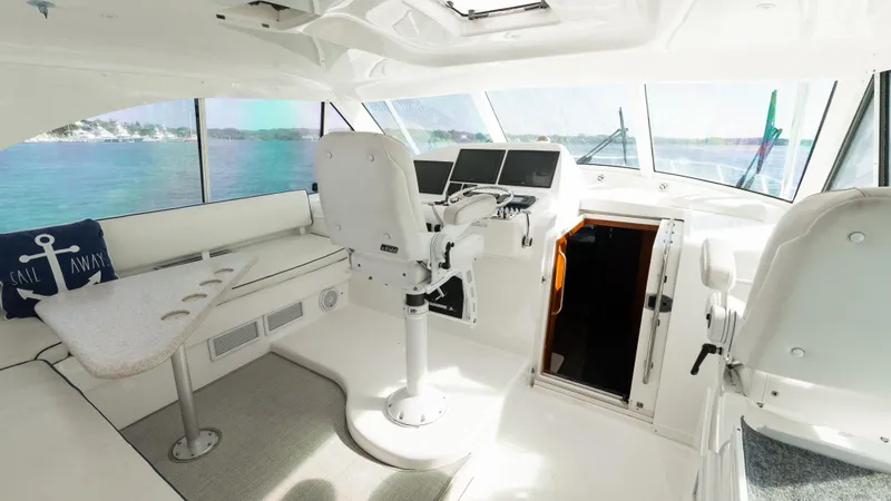 Life Of Reilly 2.0 Yacht Photos Pics Interior of 2012 Cabo 44 HTX yacht with helm and seating area.