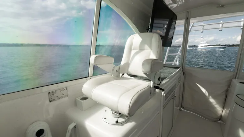 Life Of Reilly 2.0 Yacht Photos Pics Luxury helm seat on 2012 Cabo 44 HTX yacht with scenic ocean view.