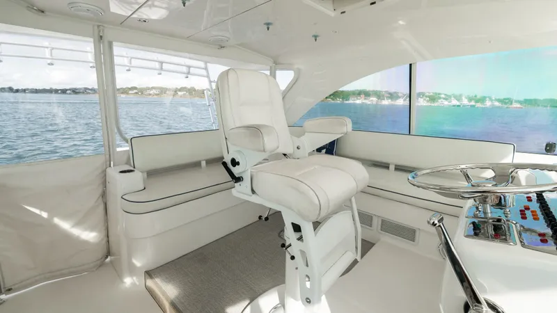 Life Of Reilly 2.0 Yacht Photos Pics Luxurious interior of 2012 Cabo 44 HTX yacht with plush seating and panoramic views.